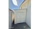 Exterior shot of a newly painted storage shed situated between home and backyard wall at 1708 W Harmont Dr, Phoenix, AZ 85021