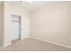 Bedroom with plush carpeting, closet, and neutral walls at 17722 W Banff Ln, Surprise, AZ 85388