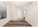 Inviting entryway features wood-look floors, natural light, and a stylish chandelier at 17722 W Banff Ln, Surprise, AZ 85388