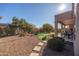 Landscaped backyard with putting green, patio, and seating area at 18603 N Twilight Way, Surprise, AZ 85374