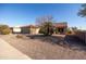 Single-story house with desert landscaping and two-car garage at 18603 N Twilight Way, Surprise, AZ 85374