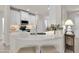 Modern kitchen with white cabinets, quartz countertops, and stainless steel appliances at 18603 N Twilight Way, Surprise, AZ 85374