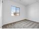 Bright bedroom with carpet flooring and window at 20019 W Campbell Ave, Buckeye, AZ 85396