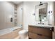 Contemporary bathroom featuring a sleek vanity, modern fixtures, and tiled shower and tub at 20653 N 101St St, Scottsdale, AZ 85255