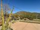 Large deck with mountain views and string lights at 210 W Yucca Ln, New River, AZ 85087
