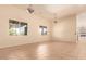 Bright dining room with tile floors and large windows at 210 W Yucca Ln, New River, AZ 85087