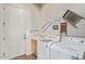 Laundry room with washer, dryer, and utility sink at 210 W Yucca Ln, New River, AZ 85087