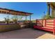 Outdoor kitchen with built-in grill, counter, and seating at 210 W Yucca Ln, New River, AZ 85087
