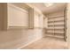 Large walk-in closet with hanging rods and shelving at 210 W Yucca Ln, New River, AZ 85087