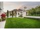 Landscaped backyard with lush lawn, pool and mountain views at 21487 N 110Th Pl, Scottsdale, AZ 85255