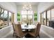 Charming breakfast nook offers a round table, and ample natural light at 21487 N 110Th Pl, Scottsdale, AZ 85255