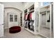 Spacious walk-in closet with ample storage shelving and hanging space at 21487 N 110Th Pl, Scottsdale, AZ 85255