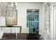 Formal dining room showcasing a wine cellar and modern chandelier at 21487 N 110Th Pl, Scottsdale, AZ 85255