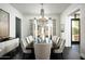 Elegant dining room with a large table, chandelier, and scenic view at 21487 N 110Th Pl, Scottsdale, AZ 85255