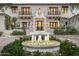 Elegant home exterior with fountain and grand entrance at 21487 N 110Th Pl, Scottsdale, AZ 85255