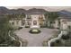 Stunning two-story home with a circular driveway and mountain views at 21487 N 110Th Pl, Scottsdale, AZ 85255