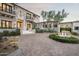 Grand home entrance with a curved driveway and landscaping at 21487 N 110Th Pl, Scottsdale, AZ 85255
