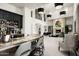 Modern home bar with a marble countertop and a view into the living room at 21487 N 110Th Pl, Scottsdale, AZ 85255