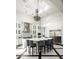 Spacious kitchen boasts a large island, stainless steel appliances, and a stunning chandelier at 21487 N 110Th Pl, Scottsdale, AZ 85255