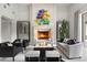 Elegant living room featuring a large fireplace at 21487 N 110Th Pl, Scottsdale, AZ 85255