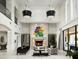 Spacious living room with a fireplace and large windows at 21487 N 110Th Pl, Scottsdale, AZ 85255