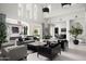 Open-concept living room with access to outdoor areas at 21487 N 110Th Pl, Scottsdale, AZ 85255