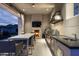 Luxury outdoor kitchen with a fireplace and grill at 21487 N 110Th Pl, Scottsdale, AZ 85255