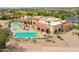 Resort-style community pool and clubhouse with multiple pools and lounge areas at 2608 E Desert Wind Dr, Casa Grande, AZ 85194