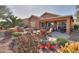 Spacious backyard patio with seating area, built-in BBQ, and mature landscaping at 2608 E Desert Wind Dr, Casa Grande, AZ 85194