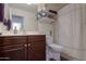 Clean bathroom with dark wood vanity and shower at 2608 E Desert Wind Dr, Casa Grande, AZ 85194