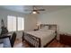 Bedroom with wooden bed frame and window at 2608 E Desert Wind Dr, Casa Grande, AZ 85194