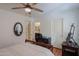 Bright bedroom with a wooden bed frame and built-in desk at 2608 E Desert Wind Dr, Casa Grande, AZ 85194