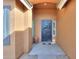 Covered entryway with a dark-colored door and a stone floor at 2608 E Desert Wind Dr, Casa Grande, AZ 85194