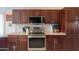 Stainless steel range and microwave in kitchen at 2608 E Desert Wind Dr, Casa Grande, AZ 85194