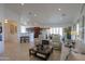 Bright living room with comfortable seating and tile flooring at 2608 E Desert Wind Dr, Casa Grande, AZ 85194