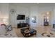 Bright living room featuring a large TV and comfortable seating at 2608 E Desert Wind Dr, Casa Grande, AZ 85194