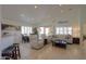 Spacious living room with light-colored furniture and recessed lighting at 2608 E Desert Wind Dr, Casa Grande, AZ 85194
