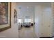 Open living room with light-colored furniture and tile floor at 2608 E Desert Wind Dr, Casa Grande, AZ 85194