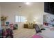 Home office with a comfy chair and built-in shelving at 2608 E Desert Wind Dr, Casa Grande, AZ 85194