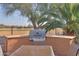 Built-in outdoor kitchen with grill and ample countertop space at 2608 E Desert Wind Dr, Casa Grande, AZ 85194