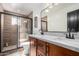 Bathroom with double vanity, marble countertop, and walk-in shower at 2739 W Ardmore Rd, Laveen, AZ 85339