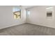 Neutral bedroom offers a blank canvas with multiple windows for ample natural lighting and soft carpeting at 2828 N Evergreen St, Buckeye, AZ 85396