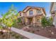 Charming townhome with neutral exterior, well-kept landscaping, and a welcoming covered entryway at 2828 N Evergreen St, Buckeye, AZ 85396