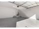 Spacious garage features epoxy flooring and ample space for parking and storage at 2828 N Evergreen St, Buckeye, AZ 85396