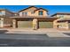Attached two-car garages feature matching doors and brick accents, offering convenience and curb appeal at 2828 N Evergreen St, Buckeye, AZ 85396