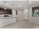 Modern kitchen view showcases an island with a sink and stainless steel appliances for a sleek design at 2828 N Evergreen St, Buckeye, AZ 85396