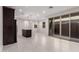 Bright, open-concept kitchen and dining area with large sliding glass doors leading to outdoor space at 2828 N Evergreen St, Buckeye, AZ 85396