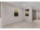 Spacious living room featuring tile floors and bright sunlight at 2828 N Evergreen St, Buckeye, AZ 85396