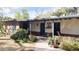 Front exterior of charming home with patio cover, cactus landscaping, and blue trim at 3142 N 27Th St, Phoenix, AZ 85016