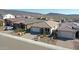 Aerial view of a new home community with desert landscape at 31983 N 124Th Dr, Peoria, AZ 85383